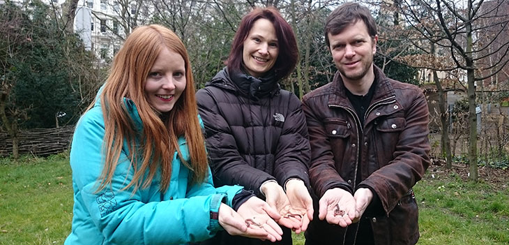 Identification trainees holding earthworms